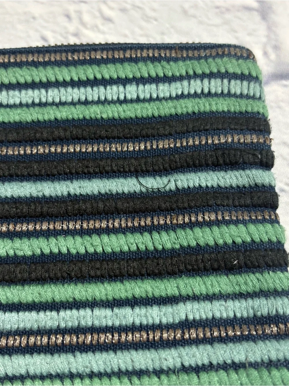 Jasper & Jeera navy/aqua striped stitch-work zipper pouch wristlet
